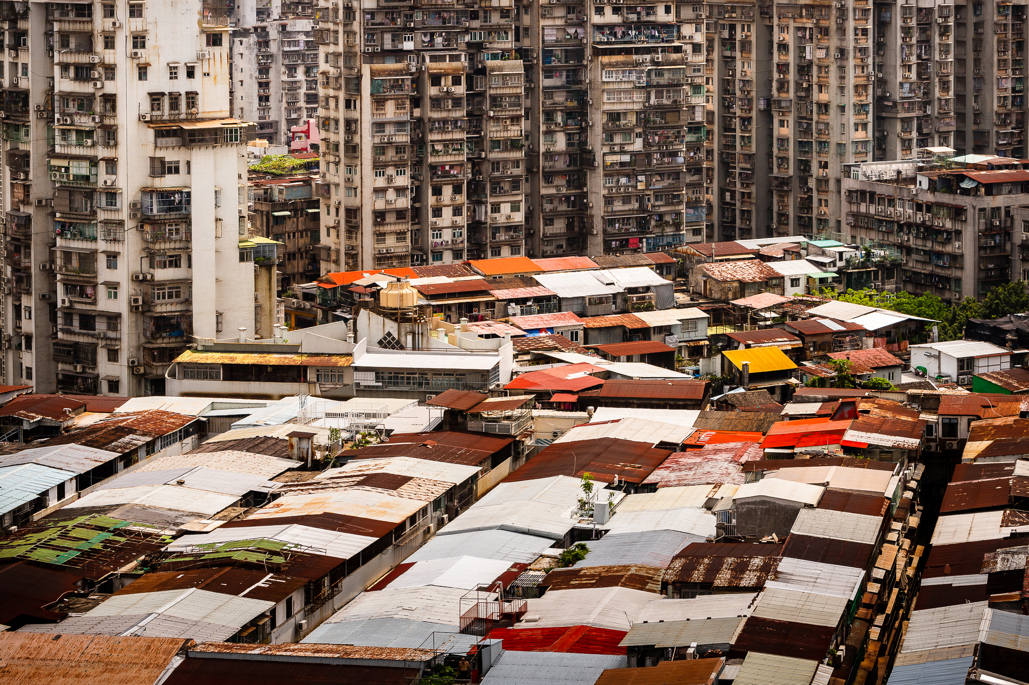 The corrugated iron roofs of tenement structures are arrayed like a giant patchwork quilt in Areia Preta