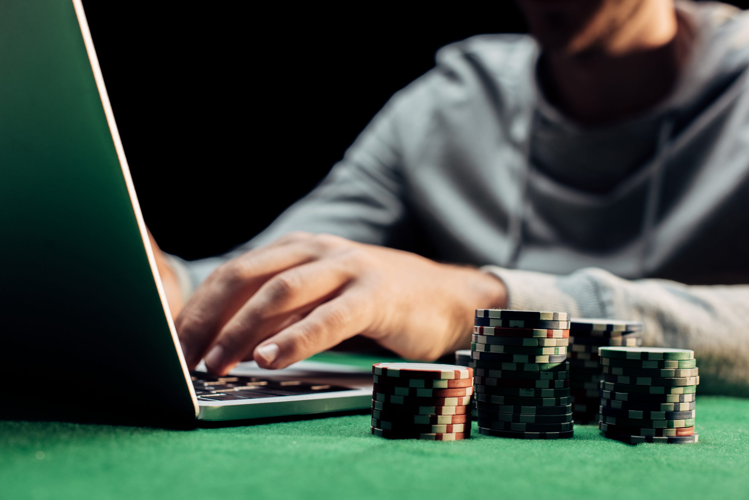 Gambler using laptop